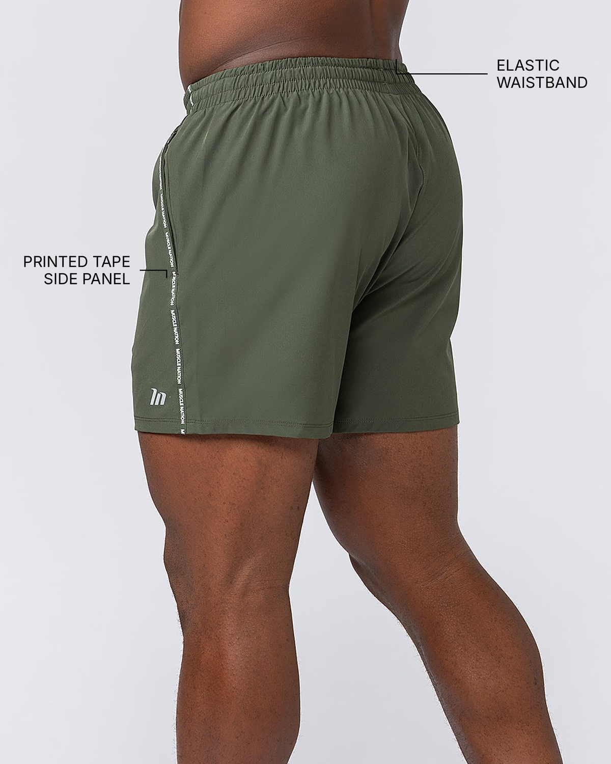 Iconic New Heights 4" Shorts - Dark Khaki - Muscle Nation feature callouts: printed tape side panel, elastic waistband