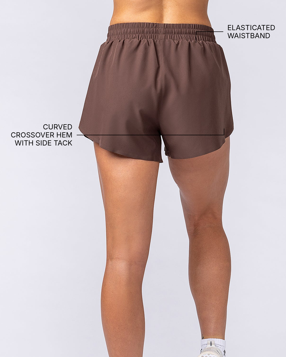 Pace 3" High-Waisted Run Shorts - Chestnut - Muscle Nation feature callouts: elasticated waistband, curved crossover hem with side tack