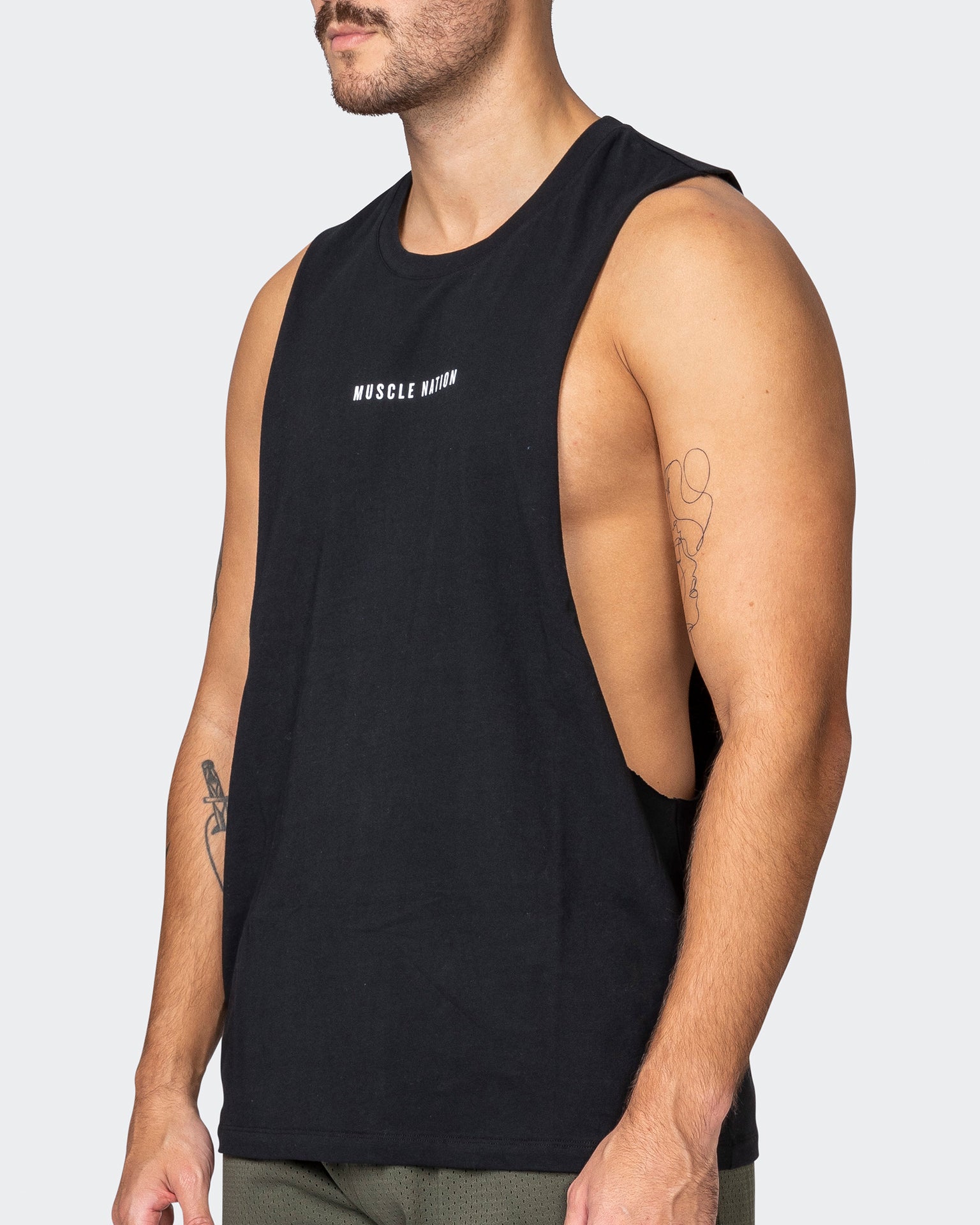 Sold Out! The Drop Arm Black Muscle Tank with White Ink with the