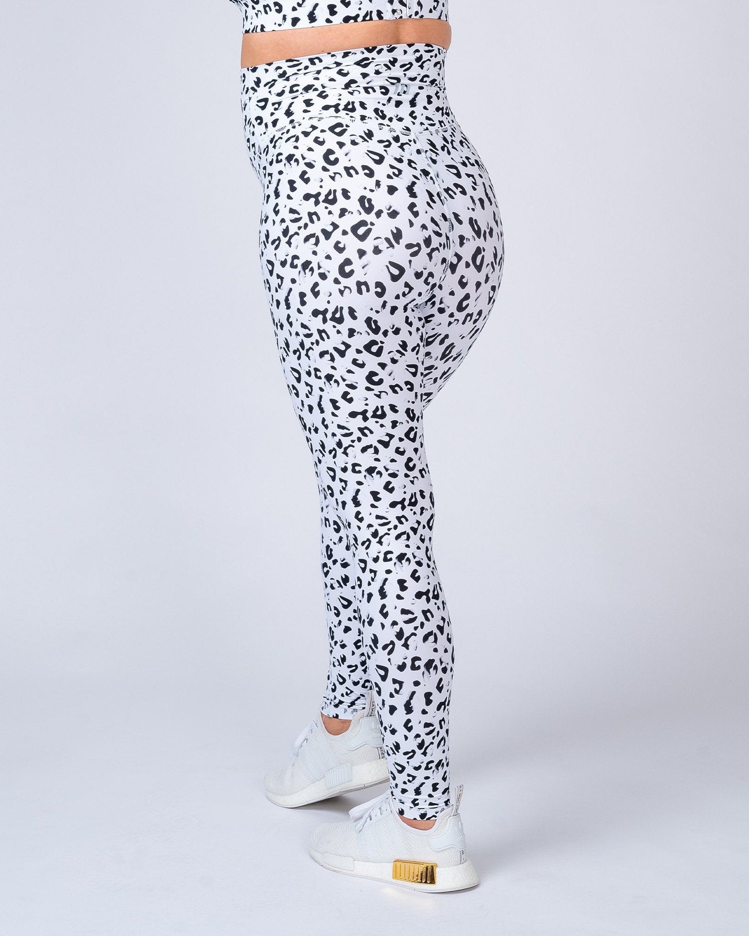 pregnant Indian woman sitting in leopard print leggings on Craiyon